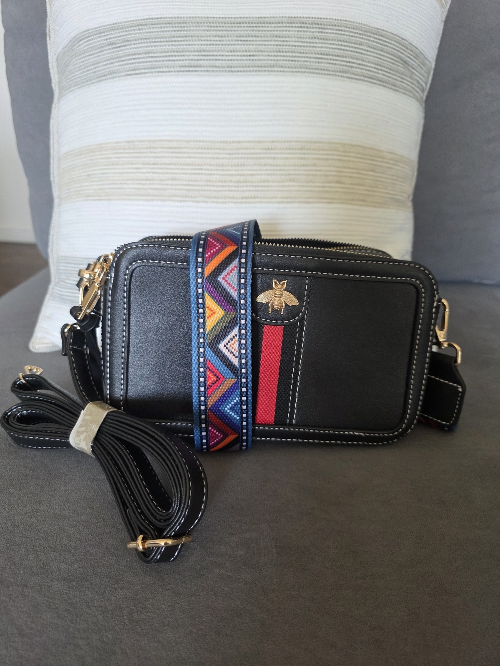 Black Crossbody Bag with Red Stripe and Colorful Woven Strap
